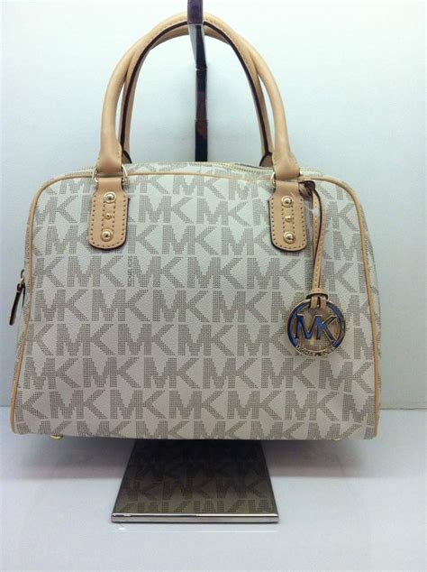 bolsa michael kors gris original precio|bolsas originales Michael Kors.